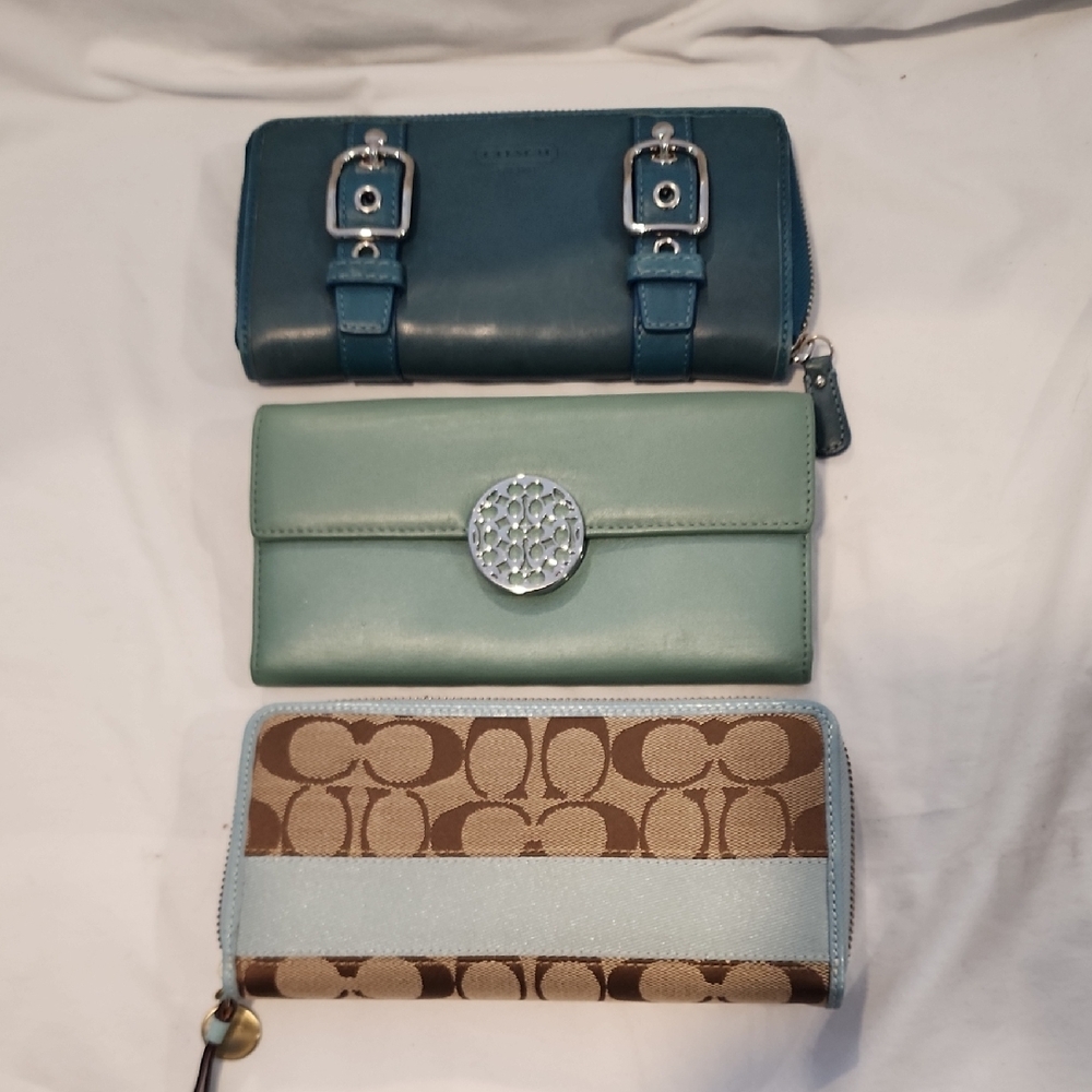 Elegant Trio of Coach Wallets in Blue, Green, and Tan